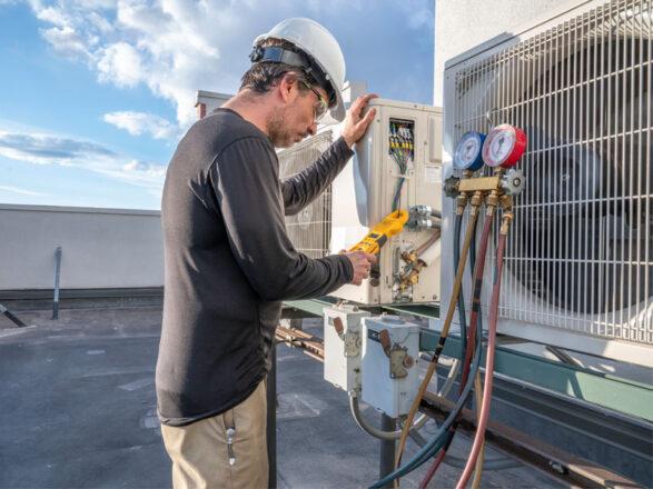 a technician performing Heating Repair in Sanford, Debary, Orange City, Deland, Lake Mary, Lake Helen and Nearby Cities