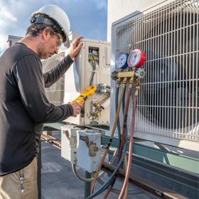 Man in the middle of a Air Conditioning Service in Lake Helen